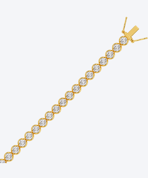 Microfusion prong natural diamond tennis bracelet in 18K yellow gold